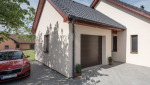 Garage en parpaing, accolé à la maison