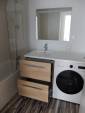 Lyon (69009) : installation d'un meuble vasque intégré pour l'emplacement du lave-linge