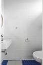 Rénovation sol et murs toilettes à Loix