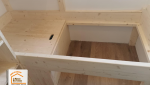meubles sur-mesure Chamonix, bois local Haute-Savoie, conception lit avec rangement, expertise artisan Chamonix, optimisation espace appartement montagnard, la maison des travaux sallanches