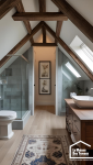 Installation d’une douche sous pente de toit