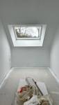 Travaux de finition – Pose du sol, peinture, et menuiseries