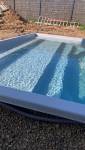 Remblaiement autour de la piscine pour stabilisation
