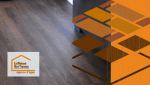Pose de parquet de qualité à Agen : contraste saisissant entre les nuances boisées du sol et la modernité des équipements de cuisine.