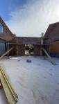 Agrandissement de la maison en reliant l'habitation principale et le garage
