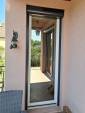 Rénovation de menuiserie avec installation de porte-fenêtre à verre traité - Lagnieu 01150