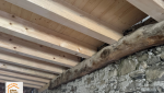  réhabilitation grange savoyarde, rénovation plancher bois massif, artisan charpentier Haute-Savoie, aménagement logement montagne, transformation grange Combloux