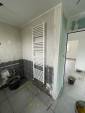 Installation d'un radiateur sèche-serviettes dans une salle de bain en rénovation - Valence 26000