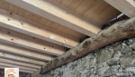 réhabilitation grange savoyarde, rénovation plancher bois massif, artisan charpentier Haute-Savoie, aménagement logement montagne, transformation grange Combloux