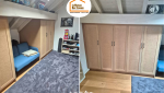 cuisine bois sur mesure, artisan ébéniste Haute-Savoie, optimisation espace maison, projet aménagement Bassin Genevois, dressing intégré sous pente