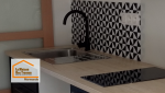 Aménagement d’une cuisine moderne pour location à Marmande avec évier intégré, plaque de cuisson et crédence graphique réalisée par La Maison Des Travaux.
