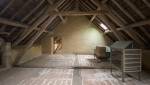 Charpente rénovée d'une maison ancienne dans le Perche