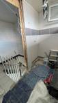 Agrandissement de la salle de bain sur le vide de la cage d'escalier 