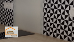 Zoom sur la crédence graphique noir et blanc de cette cuisine rénovée à Marmande. Un design moderne et durable idéal pour un appartement destiné à la location.