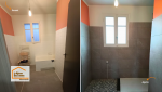 Salle de bain avant rénovation à Seyches : espace peu optimisé avec baignoire encombrante, repensé pour plus de confort et de fonctionnalité.