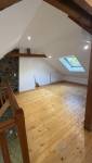 Rénovation de maison près de Vigneux-de-Bretagne : isolation sous toiture, VMC, PAC air/air et peinture pour un meilleur confort après