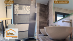 Douche à l’italienne moderne avec carrelage effet béton et finitions soignées réalisée près de Marmande pour une salle de bain élégante et durable.
