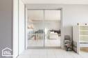 Installation d'une double porte coulissante en applique