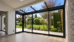 Véranda avec vue sur jardin à Craponne 69290