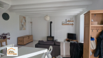 Salon rénové dans le Finistère Sud avec espace lumineux, revêtements modernes et ambiance chaleureuse. Projet réalisé avec La Maison Des Travaux Quimper.