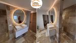 carrelage effet pierre salle de bain, robinetterie dorée salle de bain, salle de bain contemporaine Gex, rénovation intérieure Pays de Gex, artisans salle de bain