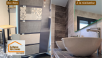 Douche à l’italienne moderne avec carrelage effet béton et finitions soignées réalisée près de Marmande pour une salle de bain élégante et durable.