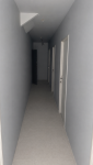 Sous sol de l'immeuble avec cloison et porte donnant aux box