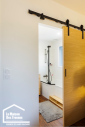 Porte en bois coulissante en applique 
