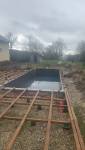 Travaux de création d'une piscine enterrée à La Côte-Saint-André avec préparation des futurs aménagements autour du bassin.