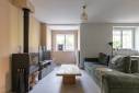 Rénovation complète d'une maison, La Tour de Salvigny (69890) : salon avec poele à bois