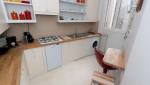 Une cuisine d'angle entièrement aménagée par des artisans de La Maison Des Travaux Boulogne-Saint Cloud