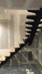 Escalier limon central bois et acier