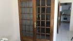 Porte à ouverture double en verre et bois