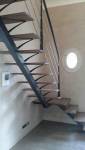 escalier suspendu bois au quart tournant arête acier et garde corps avec lices