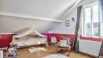 Aménagement d'une charmante chambre d'enfant sous les combles - La Maison des Travaux Paris 17