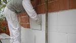 Pose de l'isolant sur un support brique
