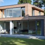 Surélévation de maison à toit plat avec bardage bois à Oullins 69600