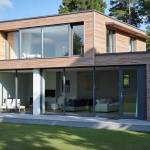 Surélévation de maison à toit plat avec bardage bois à Oullins 69600