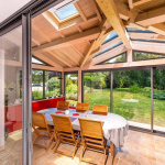 Véranda en bois et en aluminium