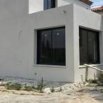 Extension en finition enduit taloché