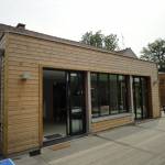 Réalisation extension bois toiture plate par La Maison Des Travaux